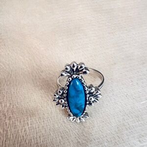 Elegant Silver Ring with Turquoise Stone and Floral Accents